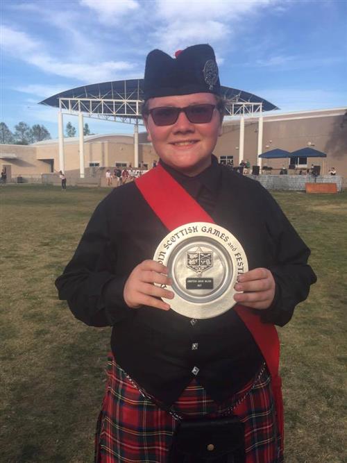 Student Michael Craven displays his drumming award Student Michael Craven displays his drumming award